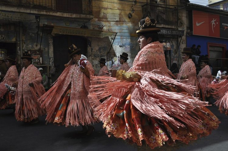 Bolivian Woman Dancing in Pink Costumes